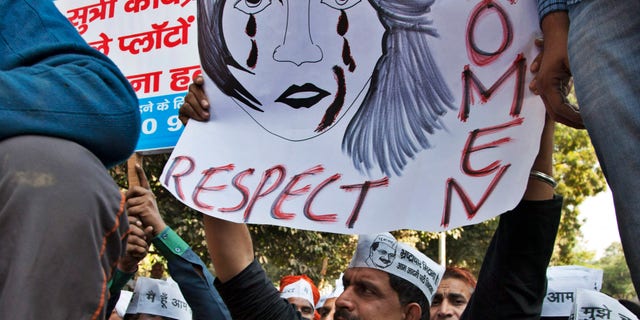 Dec. 8, 2014: Supporters of Aam Aadmi (Common Man) Party (AAP) hold placards during a protest after a woman was allegedly raped by a driver from ride-booking service Uber in New Delhi, India.