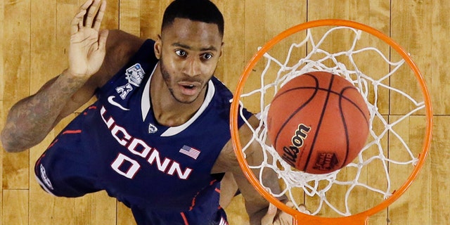 Apr. 5, 2014: Connecticut forward Phillip Nolan shoots against Florida during the second half of the NCAA Final Four tournament college basketball semifinal game in Arlington, Texas.