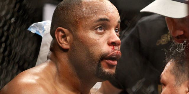 LAS VEGAS, NV - JANUARY 03: Daniel Cormier is treated between rounds as he takes on light heavyweight champion Jon Jones during the UFC 182 event at the MGM Grand Garden Arena on January 3, 2015 in Las Vegas, Nevada. Jones retained his title by unanimous decision. (Photo by Steve Marcus/Getty Images)
