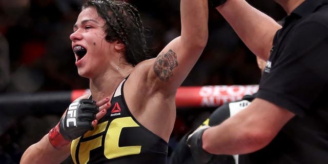 RIO DE JANEIRO, BRAZIL - AUGUST 01: Claudia Gadelha of Brazil celebrates her win overJessica Aguilar of the United States in their strawweight bout during the UFC 190 Rousey v Correia at HSBC Arena on August 1, 2015 in Rio de Janeiro, Brazil. (Photo by Matthew Stockman/Getty Images)