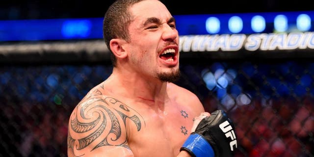 MELBOURNE, AUSTRALIA - NOVEMBER 15: Robert Whittaker celebrates his win by Unanimous Decision against Uriah Hall (not pictured) in their middleweight bout during the UFC 193 event at Etihad Stadium on November 15, 2015 in Melbourne, Australia. (Photo by Josh Hedges/Zuffa LLC/Zuffa LLC via Getty Images)