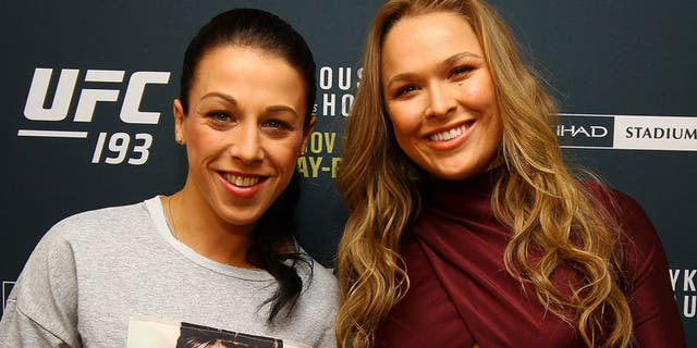 NEW YORK, NY - OCTOBER 06: (R-L) UFC women's bantamweight champion Ronda Rousey and UFC women's strawweight champion Joanna Jedrzejczyk pose for a photo at the London NYC hotel ahead of UFC 193 on October 6, 2015 in New York, United States. (Photo by Mike Stobe/Zuffa LLC/Zuffa LLC via Getty Images)
