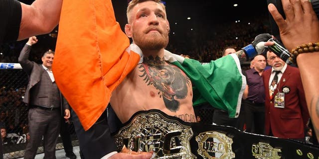 LAS VEGAS, NV - DECEMBER 12: Conor McGregor of Ireland reacts to his victory over Jose Aldo of Brazil in their UFC featherweight championship bout during the UFC 194 event inside MGM Grand Garden Arena on December 12, 2015 in Las Vegas, Nevada. (Photo by Josh Hedges/Zuffa LLC/Zuffa LLC via Getty Images)