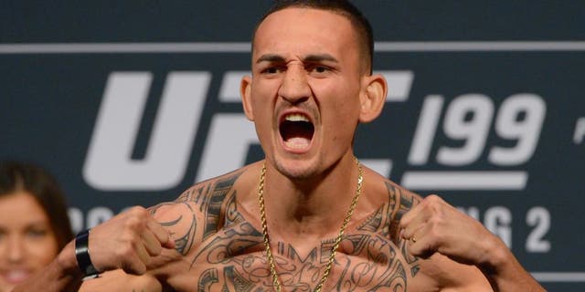 INGLEWOOD, CA - JUNE 03: Max Holloway stands on the scale during the weigh-in for UFC 199 at The Forum on June 1, 2016 in Inglewood, California. (Photo by Jayne Kamin-Oncea/Getty Images)