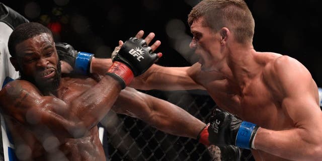 NEW YORK, NY - NOVEMBER 12: (R-L) Stephen Thompson punches Tyron Woodley in their UFC welterweight championship fight during the UFC 205 event at Madison Square Garden on November 12, 2016 in New York City. (Photo by Brandon Magnus/Zuffa LLC/Zuffa LLC via Getty Images)