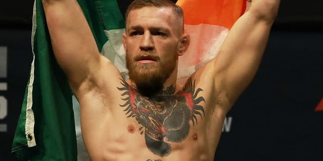 NEW YORK, NY - NOVEMBER 11: UFC Featherweight Champion Conor McGregor reacts as he walks on stage for UFC 205 Weigh-ins at Madison Square Garden on November 11, 2016 in New York City. (Photo by Michael Reaves/Getty Images)