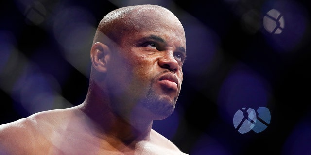 Daniel Cormier stands in the octagon before a heavyweight title mixed martial arts bout against Stipe Miocic at UFC 226.