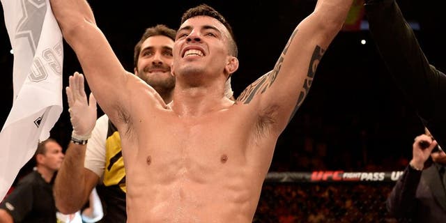 SAO PAULO, BRAZIL - NOVEMBER 07: Thomas Almeida of Brazil celebrates victory over Anthony Birchak of the United States in their bantamweight bout during the UFC Fight Night Belfort v Henderson at Ibirapuera Gymnasium on November 7, 2015 in Sao Paulo, Brazil. (Photo by Buda Mendes/Zuffa LLC/Zuffa LLC via Getty Images)