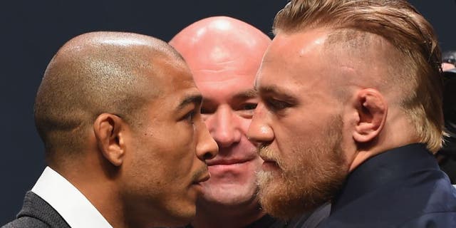 LAS VEGAS, NV - SEPTEMBER 04: (L-R) UFC featherweight champion Jose Aldo and featherweight interim champion Conor McGregor face off during the UFC's Go Big launch event inside MGM Grand Garden Arena on September 4, 2015 in Las Vegas, Nevada. (Photo by Josh Hedges/Zuffa LLC/Zuffa LLC via Getty Images)