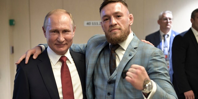 Russian President Vladimir Putin, left, and Ultimate fighting star Conor McGregor pose for a photo during the final match between France and Croatia at the 2018 soccer World Cup in the Luzhniki Stadium in Moscow, Russia.