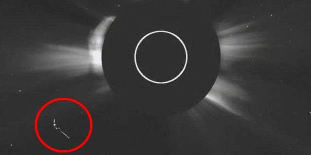 A strangely shaped object near the sun in a new NASA image has drawn the attention of UFO believers.