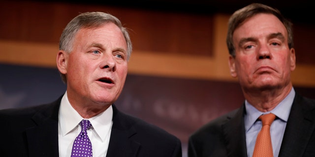 North Carolina Republican Sen. Richard Burr, left, the chairman of the Senate Intelligence Committee, with Warner.