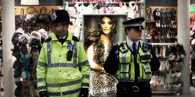 Jan. 7, 2011: A police officer, left, and a community support officer patrol St Pancras International train station in London. More police officers were being deployed at transport hubs in London amid continuing fears of a terrorist attack, British media reported Thursday. Sky News reported that transport police were told to cancel days off Friday, and that there would be a heavy police presence across the capital, including near Luton and Heathrow airports. (AP)