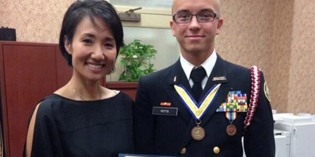 Artur Samarin, 23, was photographed with Rep. Patty Kim after he was inducted into the National Honor Society