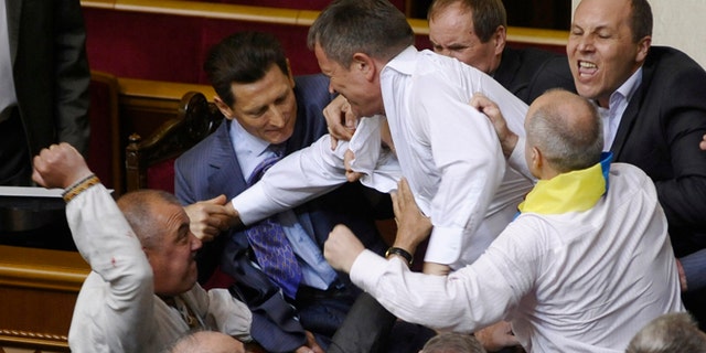 May 24, 2012: Lawmakers from pro-presidential and oppositional factions fight in the parliament session hall in Kiev, Ukraine.