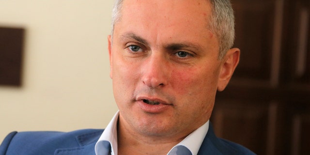Col. Serhiy Demydiuk, the head of Ukraine's national CyberPolice unit talks during an interview with the Associated Press in his office in Kiev Monday.