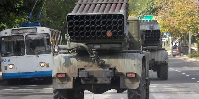 Sept. 11, 2014: Pro-Russian rebels drive multiple rocket launchers "Grad" (means "hail") in the town of Donetsk, eastern Ukraine. (AP)