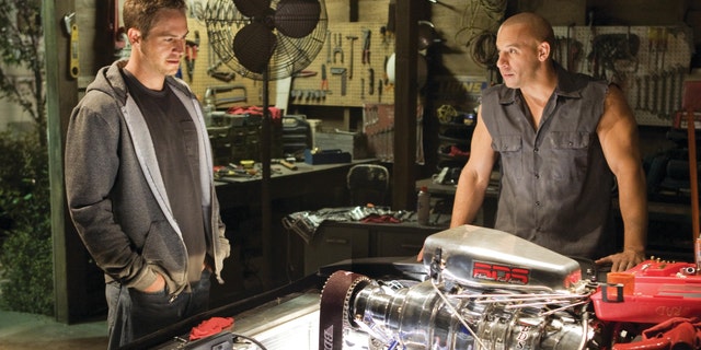 Paul Walker and Vin Diesel in a scene "Fast & Furious 7."