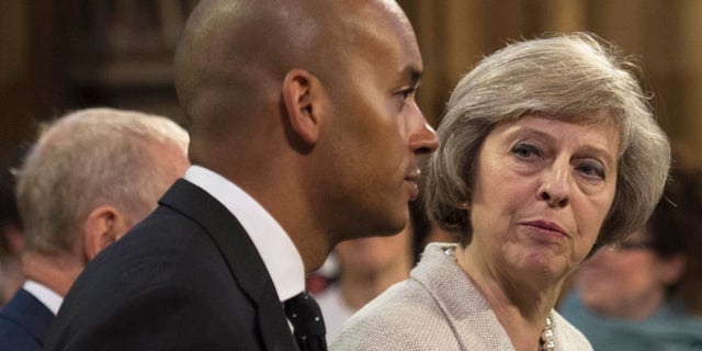 May 18, 2016: Home Secretary Theresa May and Labour MP Chuka Umunna pass through the Central Lobby for the State Opening of Parliament at the Palace of Westminster in London, Britain.