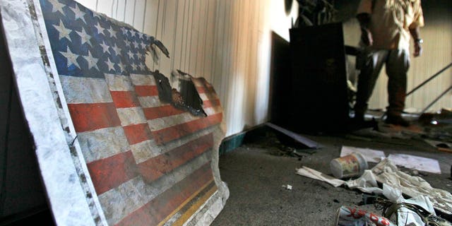 A US embassy broken flag during a visit for the press in the vandalized US Embassy in Tripoli, Libya, Monday, Sept. 12, 2011.