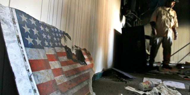A US embassy broken flag during a visit for the press in the vandalized US Embassy in Tripoli, Libya, Monday, Sept. 12, 2011.