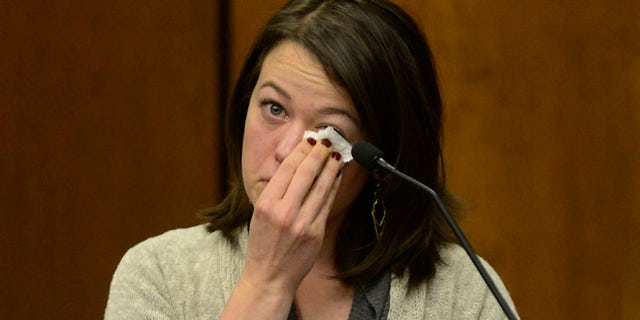 Michelle Wilkins reacts as she testifies in court. Wilkins, who had her baby cut from her womb by someone she just met, said she told herself she had to survive for the sake of her unborn daughter and tried to fight back.