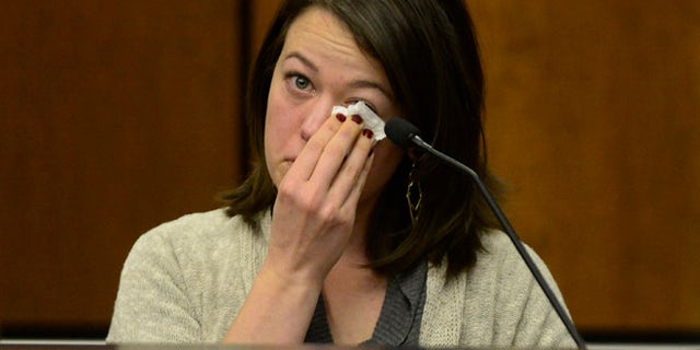 Michelle Wilkins reacts as she testifies in court. Wilkins, who had her baby cut from her womb by someone she just met, said she told herself she had to survive for the sake of her unborn daughter and tried to fight back.