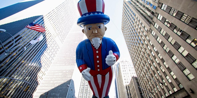 Nov. 28, 2013: An Uncle Sam balloon floats down Sixth Avenue during the 87th Macy's Thanksgiving Day Parade.
