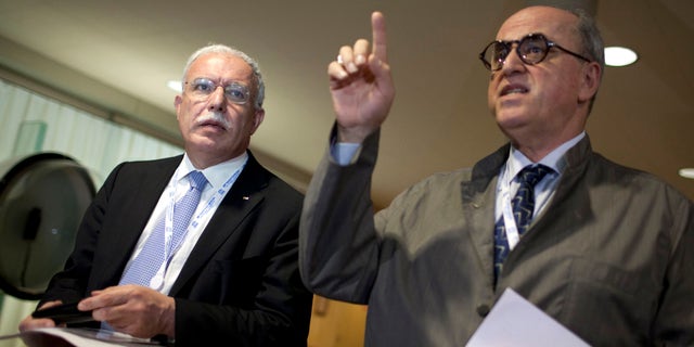 Oct. 31, 2011: Palestinian Foreign Minister Riad al-Maliki, left, is seen with historian and Ambassador for Palestine at UNESCO Elias Sanbar, left, during a session of UNESCO's 36th General Conference, in Paris.