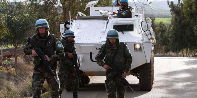 Jan. 14, 2009: Spanish U.N peacekeepers patrol the area where a rocket fell short in Lebanon several kilometers north of the Israeli border, near the village of el-Meri, southern Lebanon. Russia's aggressiveness in the east.