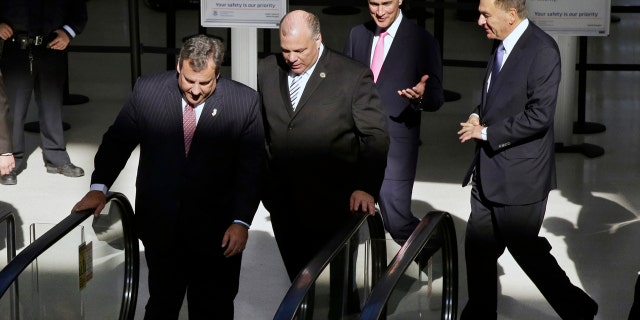Nov. 14, 2013: New Jersey Gov. Chris Christie, left, New Jersey Senate President Steve Sweeney, second left, United Airlines CEO Jeff Smisek, third left, and New York/New Jersey Port Authority Chairman David Samson, fourth left, walk together at Newark Liberty International Airport, in Newark, N.J.