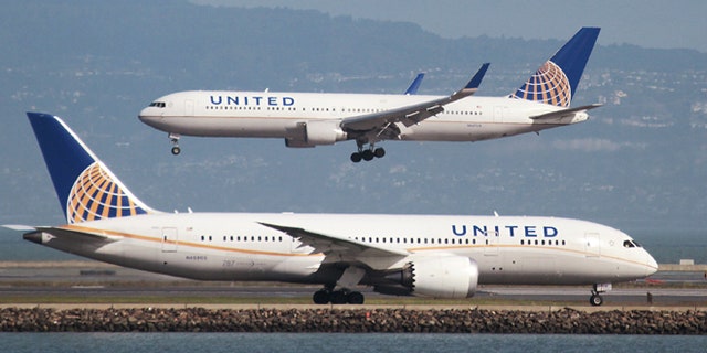 Feb. 7, 2015: A United Airlines Boeing 787 taxis as a United Airlines Boeing 767 lands at San Francisco International Airport, San Francisco, California.
