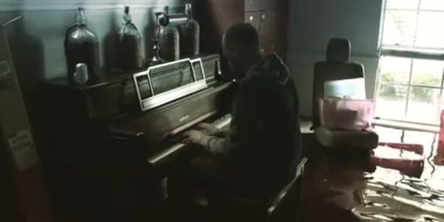 Texas resident Aric Harding posted a video to Instagram of him playing the piano in knee-deep water.