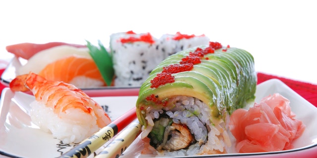 Set of rolls and sushi on several plates