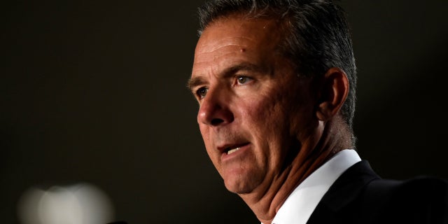 Ohio State head coach Urban Meyer was placed on paid leave as the school investigated the way he handled abuse allegations leveled by the ex-wife of former coach Zach Smith.