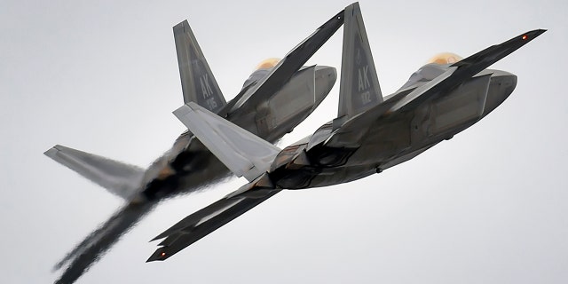 Two F-22 fighter jets from the 3rd Wing at Joint Base Elmendorf-Richardson, Alaska, conduct approach training, in this U.S. Air Force picture taken March 24, 2016.