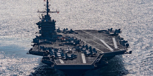 The aircraft carrier USS Harry S. Truman navigates the Gulf of Oman.