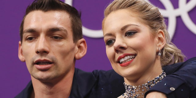 Alexa Scimeca Knierim and Chris Knierim of the USA react as they wait for their scores to be posted following their performance in the pair figure skating short program in the Gangneung Ice Arena at the 2018 Winter Olympics in Gangneung, South Korea, Wednesday, Feb. 14, 2018.