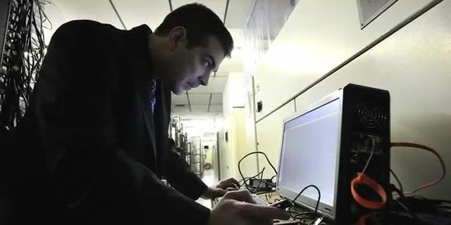 March 23, 2012: Digital forensic examiner Ashim Kapur disables a computer running the Zeus botnet in Scranton, PA.