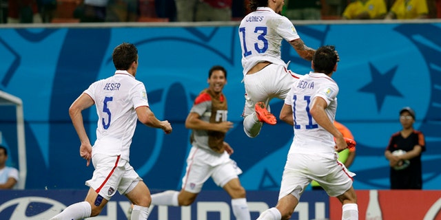 June 22, 2014: United States' Jermaine Jones (13) celebrates after scoring his side's first goal during the group G World Cup soccer match between the United States and Portugal at the Arena da Amazonia in Manaus, Brazil.