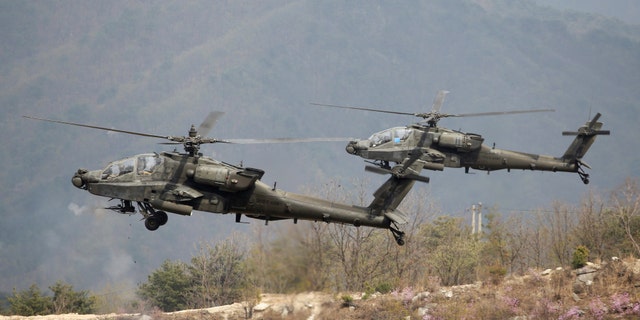 U.S. Army's AH-64 Apache helicopters fire, during a U.S.-South Korea joint live-fire military exercise, at a training field, near the demilitarized zone, separating the two Koreas in Pocheon, South Korea April 21, 2017. Picture taken on April 21, 2017. REUTERS/Kim Hong-Ji - RTS13XNN
