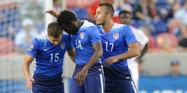 SANDY UT- OCTOBER 13: Marc Pelosi #15 of the United States is congratulated by teammates Fatai Alashe #14 and Jerome Kiesewetter #17 after he scored the winning goal against Canada during the third place CONCACAF Olympic Qualifying match at Rio Tinto Stadium on October 13, 2015 in Sandy, Utah. The United States beat Canada 2-0. (Photo by Gene Sweeney Jr/Getty Images)