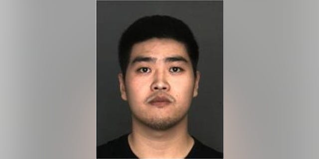 Enping Qu, 22, was accused of pouring boiling water on his girlfriend's dog.