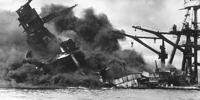 The battleship USS Arizona sinks after being hit by a Japanese air attack on Pearl Harbor, Hawaii, December 7, 1941. Picture taken December 7, 1941.