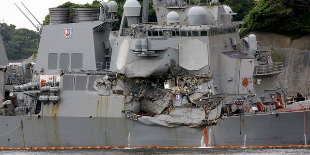 The damaged USS Fitzgerald is docked at the U.S. Naval base in Yokosuka.