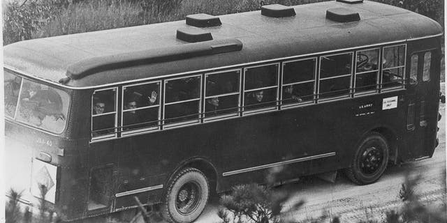 The crew in buses after entering South Korea.