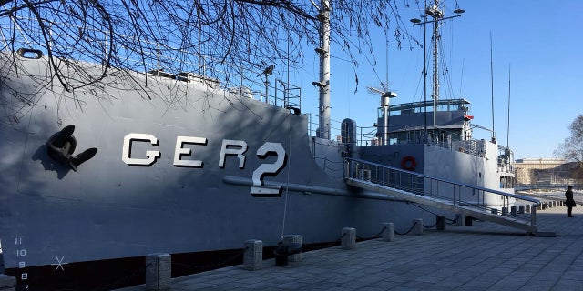 A North Korean military guard keeps watch over the USS Pueblo in Pyongyang, North Korea.