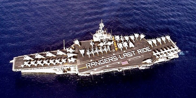 The ship is too big to squeeze through the Panama Canal, and will instead make a five-month journey around the tip of South America. (US Navy)