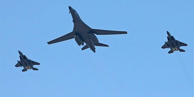 U.S. Air Force B-1B bomber, center, and two South Korean fighter jets F-15K fly over the Seoul Airport where a site for the 2017 Seoul International Aerospace and Defense Exhibition is taking place in Seongnam, South Korea, Saturday,
