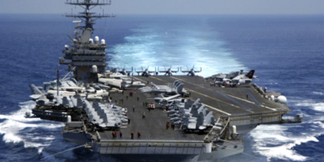 March 15, 2005: The nuclear powered aircraft carrier USS Carl Vinson (CVN 70) plows through the Indian Ocean as aircraft on its flight deck are prepared for flight operations.